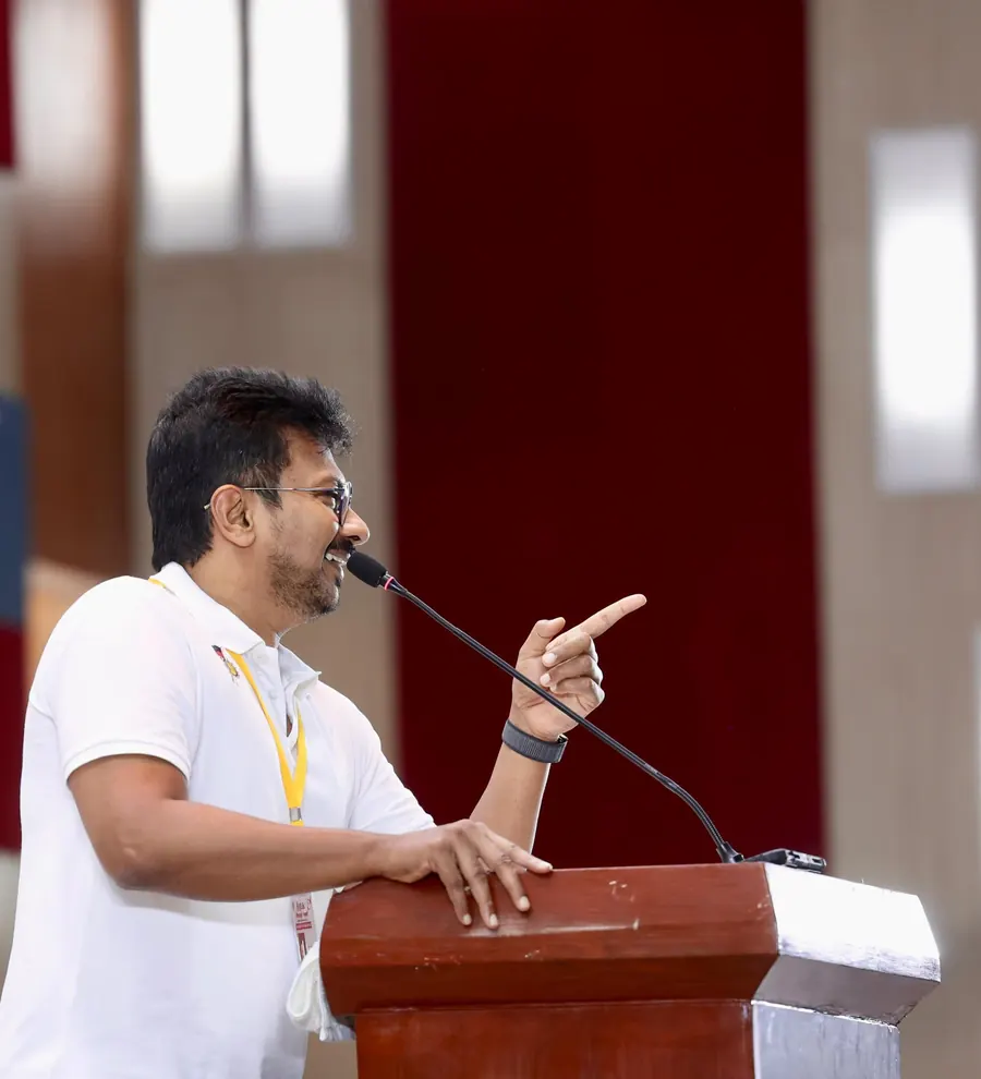 Speaker at a podium addressing a gathering